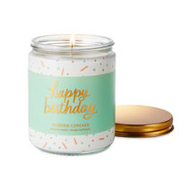 a candle that reads happy birthday featuring confetti in the design